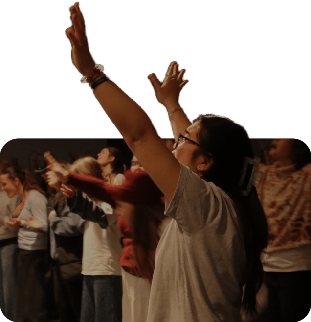 Young people worshipping together